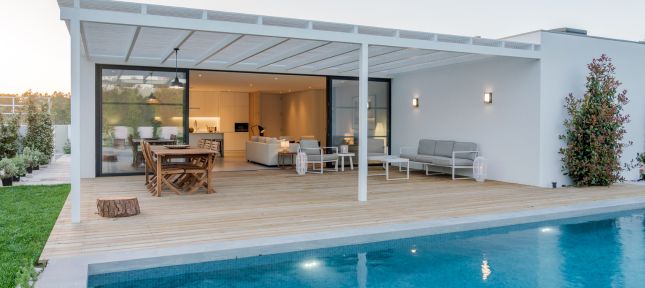 Modern house with garden swimming pool and wooden deck